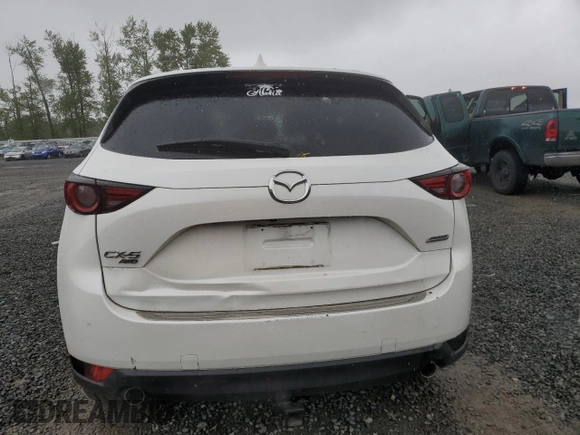 2019 Mazda CX-5 Grand Touring with VIN JM3KFBDM4K0669589, listed as a Copart auction lot 54948455 with 64,475 mi miles and Salvage Title. Bid and sale history available at carsss.com. Image 6.