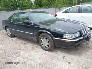 2002 Cadillac Eldorado ESC z VIN 1G6EL12Y82B105241, wystawiony jako IAAI lot #42241609 z przebiegiem 90 442 mil mil oraz . Historia ofert i sprzedaży dostępna na DreamBid. Obrazek 1.