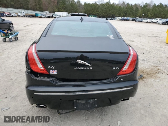 2015 Jaguar XJ with VIN SAJWA1CZ1F8V85402, listed as a Copart auction lot 86717734 with 201,249 mi miles and Salvage Title. Bid and sale history available at carsss.com. Image 6.