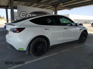 2023 Tesla Model Y Long Range with VIN 7SAYGDEE8PF620703, listed as a Copart auction lot 54655105 with 29,538 mi miles and Salvage Title. Bid and sale history available at DreamBid. Image 3.