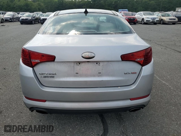 2013 Kia Optima EX z VIN 5XXGN4A79DG217554, wystawiony jako Copart lot #59667065 z przebiegiem 102 482 mil mil oraz Szkoda całkowita • Salvage title. Historia ofert i sprzedaży dostępna na DreamBid. Obrazek 6.