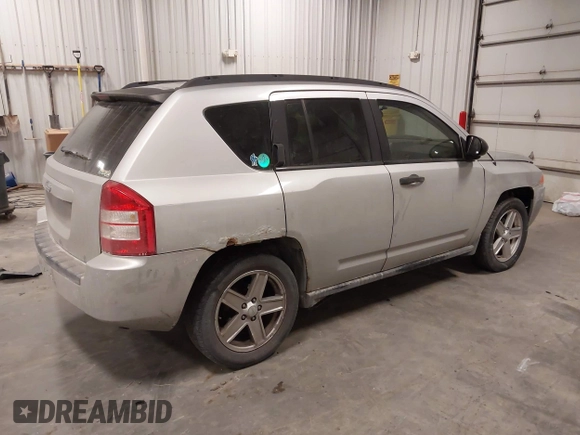2007 Jeep Compass Sport with VIN 1J8FF47W57D598222, listed as a IAAI auction lot 41379480 with 181,919 mi miles. Bid and sale history available at carsss.com. Image 4.