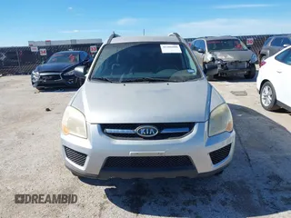 2009 Kia Sportage LX with VIN KNDJF724X97556574, listed as a IAAI auction lot 42206080 with 115,868 mi miles and . Bid and sale history available at carsss.com. Image 6.
