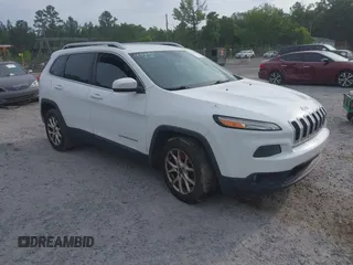 2016 Jeep Cherokee Latitude z VIN 1C4PJLCBXGW125475, wystawiony jako IAAI lot #42277105 z przebiegiem 117 755 mil mil oraz . Historia ofert i sprzedaży dostępna na DreamBid. Obrazek 1.