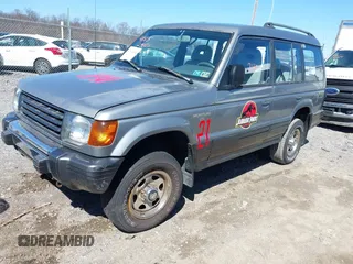 1993 Mitsubishi Montero z VIN JA4MR41H4PJ007602, wystawiony jako IAAI lot #41832401 z przebiegiem 191 549 mil mil oraz . Historia ofert i sprzedaży dostępna na DreamBid. Obrazek 2.