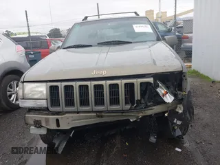 1998 Jeep Grand Cherokee Limited with VIN 1J4GZ78YXWC236969, listed as a IAAI auction lot 41095686 with 182,001 mi miles. Bid and sale history available at carsss.com. Image 13.