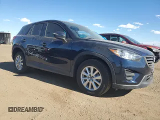 2016 Mazda CX-5 Sport with VIN JM3KE4BY4G0734582, listed as a Copart auction lot 55908515 with 52,323 mi miles and Salvage title. Bid and sale history available at DreamBid. Image 4.