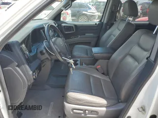 2012 Honda Ridgeline RTL with VIN 5FPYK1F56CB002709, listed as a Copart auction lot 62642495 with 116,416 mi miles and Salvage title. Bid and sale history available at DreamBid. Image 7.