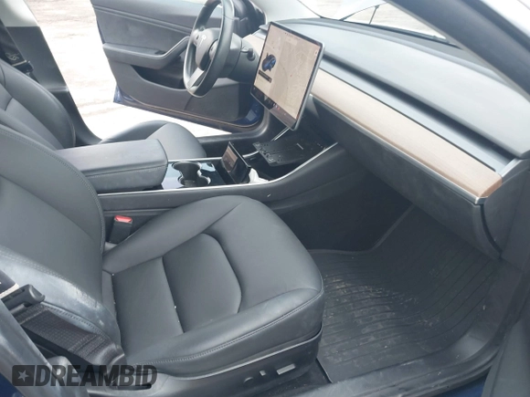 2019 Tesla Model 3 Mid Range with VIN 5YJ3E1EA5KF299589, listed as a IAAI auction lot 41709733 with 50,256 mi miles and . Bid and sale history available at DreamBid. Image 5.
