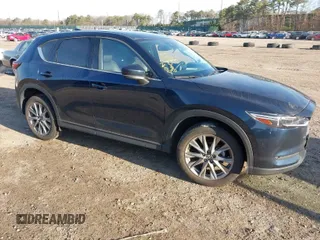 2020 Mazda CX-5 Grand Touring with VIN JM3KFBDM4L0779284, listed as a IAAI auction lot 42060936 with 9,227 mi miles. Bid and sale history available at carsss.com. Image 1.