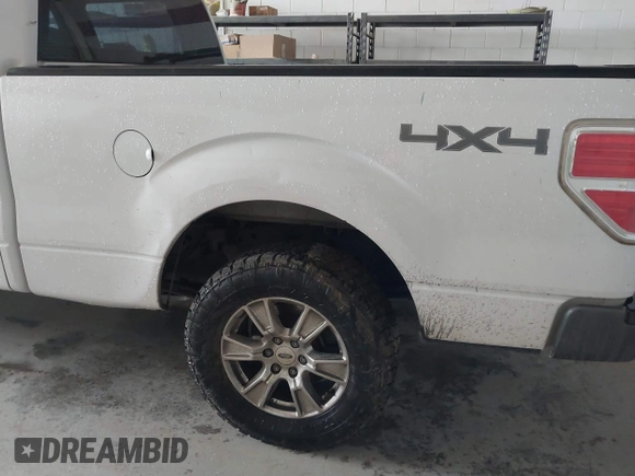 2014 Ford F-150 XL with VIN 1FTFW1EF5EKE45762, listed as a IAAI auction lot 41762773 with 203,423 mi miles. Bid and sale history available at carsss.com. Image 6.