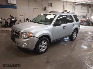 2010 Ford Escape XLT with VIN 1FMCU0DG5AKB02811, listed as a IAAI auction lot 41749335 with 103,071 mi miles. Bid and sale history available at carsss.com. Image 2.