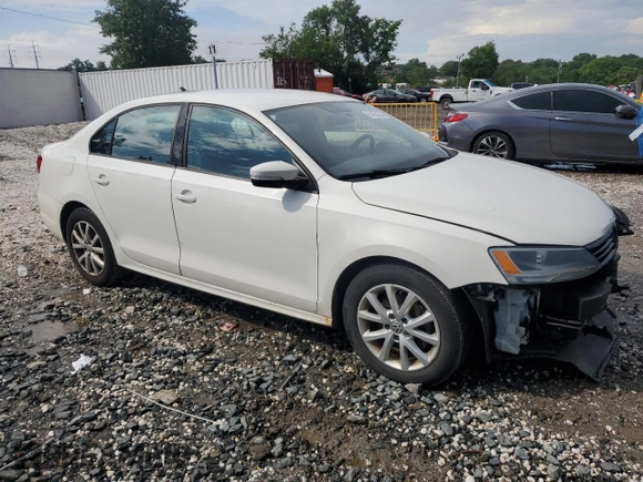 2012 Volkswagen Jetta SE with VIN 3VWDX7AJ3CM472074, listed as a Copart auction lot 61433125 with 185,861 mi miles and Salvage title. Bid and sale history available at DreamBid. Image 4.
