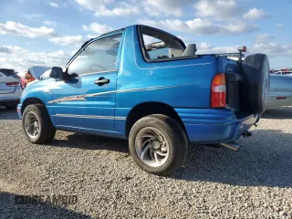 2001 Suzuki Vitara JLS z VIN 2S3TC52C116101163, wystawiony jako Copart lot #74469744 z przebiegiem Nie podano mil oraz Szkody całkowita. Historia ofert i sprzedaży dostępna na DreamBid. Obrazek 2.