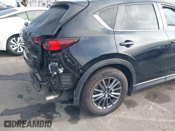 2021 Mazda CX-5 Touring with VIN JM3KFACM2M0339349, listed as a IAAI auction lot 41651005 with 53,792 mi miles. Bid and sale history available at carsss.com. Image 18.