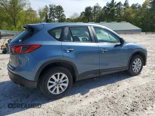 2016 Mazda CX-5 Sport with VIN JM3KE4BY8G0745522, listed as a Copart auction lot 56621825 with 98,757 mi miles and Salvage title. Bid and sale history available at DreamBid. Image 3.