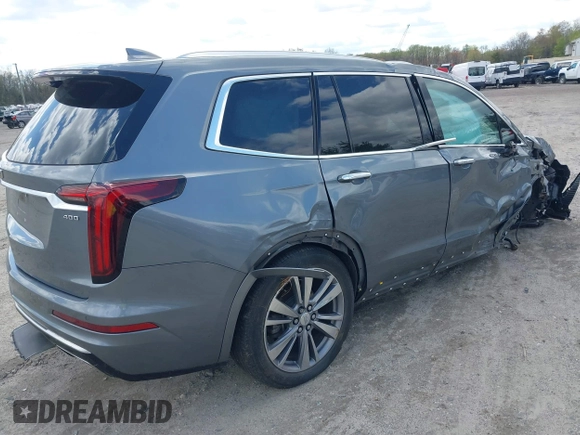 2020 Cadillac XT6 FWD Premium Luxury z VIN 1GYKPCRS9LZ129763, wystawiony jako IAAI lot #42052532 z przebiegiem 57 670 mil mil oraz . Historia ofert i sprzedaży dostępna na DreamBid. Obrazek 4.