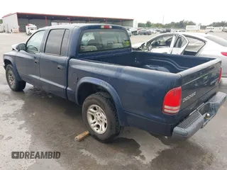2003 Dodge Dakota Sport with VIN 1D7HL38X13S381160, listed as a IAAI auction lot 42191397 with 97,752 mi miles and . Bid and sale history available at DreamBid. Image 3.
