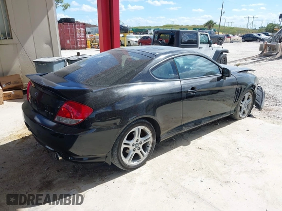 2006 Hyundai Tiburon GT z VIN KMHHN65F56U224768, wystawiony jako IAAI lot #40672721 z przebiegiem 158 535 mil mil oraz . Historia ofert i sprzedaży dostępna na DreamBid. Obrazek 4.