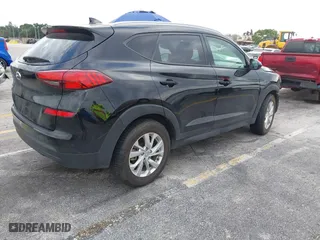 2019 Hyundai Tucson Value with VIN KM8J33A40KU068014, listed as a IAAI auction lot 40877057 with 34,966 mi miles. Bid and sale history available at carsss.com. Image 4.
