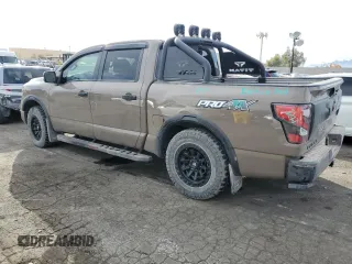 2024 Nissan Titan Pro-4X with VIN 1N6AA1ED3RN103011, listed as a Copart auction lot 87050954 with 8,829 mi miles and Salvage title. Bid and sale history available at DreamBid. Image 2.