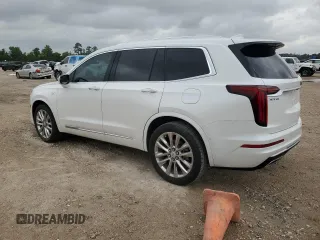 2021 Cadillac XT6 Premium Luxury with VIN 1GYKPCRSXMZ169206, listed as a Copart auction lot 55953525 with 64,789 mi miles and Salvage Title. Bid and sale history available at DreamBid. Image 2.