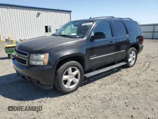 2010 Chevrolet Tahoe LTZ with VIN 1GNUKCE08AR117979, listed as a Copart auction lot 64802225 with 228,769 mi miles and Salvage title. Bid and sale history available at DreamBid. Image 1.
