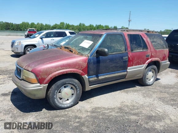 2000 GMC Jimmy SL with VIN 1GKCS13W9Y2264710, listed as a IAAI auction lot 42136082 with 206,584 mi miles. Bid and sale history available at carsss.com. Image 6.
