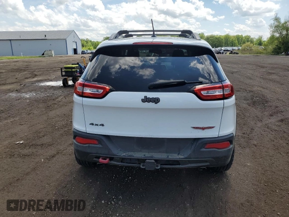 2014 Jeep Cherokee Trailhawk z VIN 1C4PJMBS5EW201897, wystawiony jako Copart lot #57378795 z przebiegiem 172 715 mil mil oraz Szkoda całkowita • Salvage title. Historia ofert i sprzedaży dostępna na DreamBid. Obrazek 6.