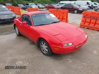 1991 Mazda MX-5 Miata Special Edition z VIN JM1NA3511M0216399, wystawiony jako IAAI lot #42117625 z przebiegiem 126 891 mil mil oraz . Historia ofert i sprzedaży dostępna na DreamBid. Obrazek 1.