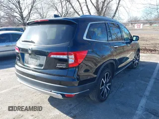 2022 Honda Pilot Touring 7-Passenger with VIN 5FNYF6H63NB006591, listed as a IAAI auction lot 41471359 with 75,574 mi miles. Bid and sale history available at carsss.com. Image 4.
