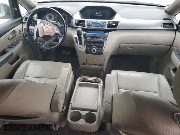 2012 Honda Odyssey Touring with VIN 5FNRL5H9XCB078399, listed as a Copart auction lot 52360165 with 174,819 mi miles and Salvage Title. Bid and sale history available at DreamBid. Image 8.