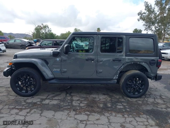 2021 Jeep Wrangler 4xe Unlimited Sahara with VIN 1C4JJXP64MW720263, listed as a IAAI auction lot 41514302 with 73,300 mi miles. Bid and sale history available at carsss.com. Image 15.