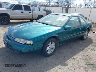 1997 Ford Thunderbird LX with VIN 1FALP62W7VH153454, listed as a IAAI auction lot 41833472 with 147,269 mi miles and . Bid and sale history available at DreamBid. Image 2.