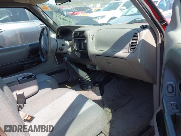 2002 Mazda B-Series Truck SX with VIN 4F4YR12D02TM01264, listed as a IAAI auction lot 41908459 with 205,445 mi miles and . Bid and sale history available at DreamBid. Image 5.