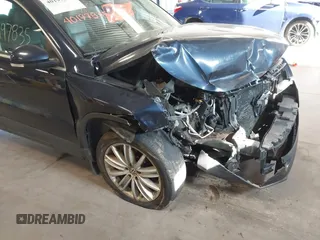 2011 Volkswagen Tiguan SE with VIN WVGBV7AXXBW533872, listed as a IAAI auction lot 40197835 with 104,685 mi miles and . Bid and sale history available at DreamBid. Image 6.