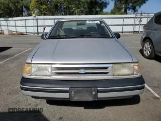 1989 Ford Tempo z VIN 1FAPP31X0KK113919, wystawiony jako Copart lot #76599314 z przebiegiem 65 823 mil mil oraz Tytuł czysty. Historia ofert i sprzedaży dostępna na DreamBid. Obrazek 5.