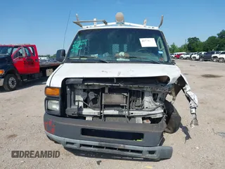 2014 Ford Econoline Cargo Commercial with VIN 1FTNE1EW4EDB20183, listed as a IAAI auction lot 42231075 with 260,818 mi miles and . Bid and sale history available at DreamBid. Image 12.