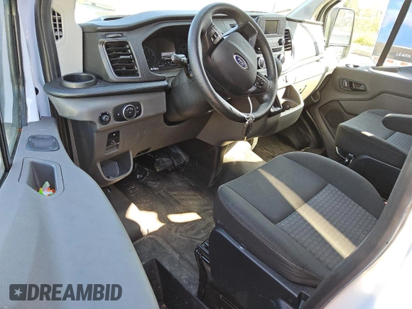 2023 Ford Transit Cargo with VIN 1FTBR1Y86PKA17978, listed as a Copart auction lot 77180324 with 20,173 mi miles and Clean Title. Bid and sale history available at DreamBid. Image 8.