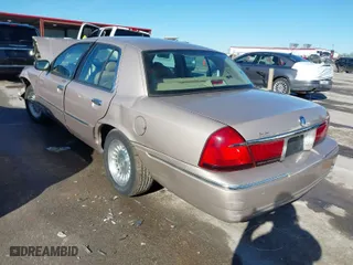 1998 Mercury Grand Marquis LS with VIN 2MEFM75W7WX665734, listed as a IAAI auction lot 41390381 with 74,385 mi miles. Bid and sale history available at carsss.com. Image 3.