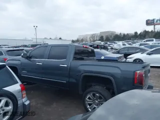 2018 GMC Sierra 1500 Denali with VIN 3GTU2PEJ8JG571593, listed as a IAAI auction lot 41169420 with 98,501 mi miles. Bid and sale history available at carsss.com. Image 14.