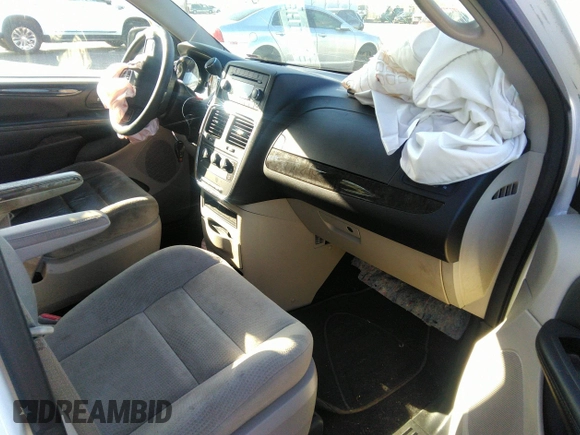 2014 Dodge Grand Caravan American Value with VIN 2C4RDGBG7ER345277, listed as a IAAI auction lot 42061355 with 145,889 mi miles and . Bid and sale history available at DreamBid. Image 5.