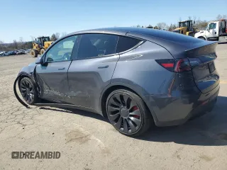 2023 Tesla Model Y Performance z VIN 7SAYGDEF9PF865129, wystawiony jako Copart lot #50228735 z przebiegiem Nie podano mil oraz Szkoda całkowita • Salvage title. Historia ofert i sprzedaży dostępna na DreamBid. Obrazek 2.