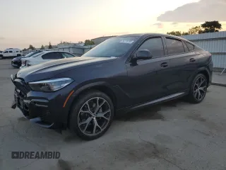 2023 BMW X6 xDrive40i z VIN 5UXCY6C04P9R37846, wystawiony jako Copart lot #54778735 z przebiegiem Nie podano mil oraz Szkoda całkowita • Salvage title. Historia ofert i sprzedaży dostępna na DreamBid. Obrazek 1.
