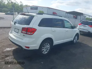 2015 Dodge Journey SXT with VIN 3C4PDCBG0FT653857, listed as a IAAI auction lot 42128410 with 182,960 mi miles and . Bid and sale history available at DreamBid. Image 4.