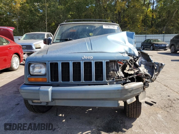 1998 Jeep Cherokee Sport with VIN 1J4FT68S4WL121559, listed as a Copart auction lot 77387794 with 163,453 mi miles and Salvage Title. Bid and sale history available at carsss.com. Image 5.