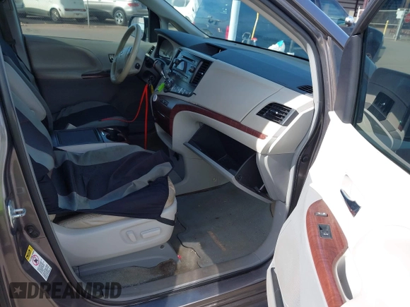 2014 Toyota Sienna XLE with VIN 5TDYK3DC2ES438980, listed as a IAAI auction lot 42067750 with 143,728 mi miles and . Bid and sale history available at DreamBid. Image 5.