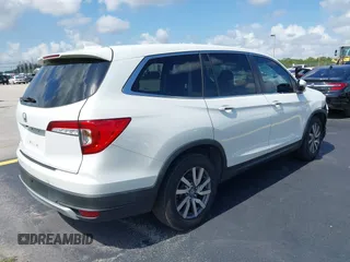 2020 Honda Pilot EX-L with VIN 5FNYF5H59LB028268, listed as a IAAI auction lot 42355620 with 107,033 mi miles and . Bid and sale history available at DreamBid. Image 4.