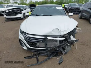 2021 Volkswagen Arteon SEL R-Line z VIN WVWSR7AN6ME007156, wystawiony jako IAAI lot #42254735 z przebiegiem 32 004 mil mil oraz . Historia ofert i sprzedaży dostępna na DreamBid. Obrazek 13.