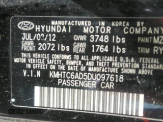 2013 Hyundai Veloster w/Black Int with VIN KMHTC6AD5DU097618, listed as a IAAI auction lot 41876394 with 159,519 mi miles. Bid and sale history available at carsss.com. Image 9.